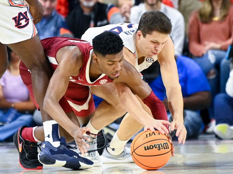 Feb 11, 2023; Auburn, Alabama, USA;  Alabama Crimson Tide forward Brandon Miller (24) and Auburn Tigers guard Lior Berman (24) battle for ball possession at Neville Arena. Mandatory Credit: Julie Bennett-USA TODAY Sports