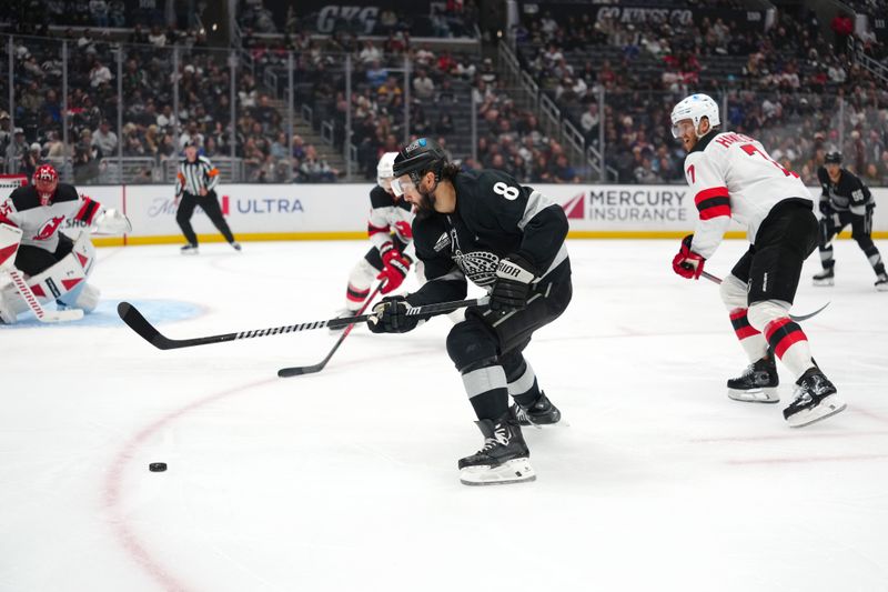 Nov 1, 2025; Los Angeles, California, USA; Los Angeles Kings defenseman Drew Doughty (8) handles the puck against the New Jersey Devils in the second period at Crypto.com Arena. Mandatory Credit: Kirby Lee-Imagn Images