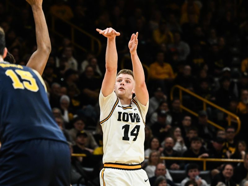 Mar 5, 2026; Iowa City, Iowa, USA; Iowa Hawkeyes guard Bennett Stirtz (14) shoots the ball against the Michigan Wolverines during the second half at Carver-Hawkeye Arena. Mandatory Credit: Jeffrey Becker-Imagn Images