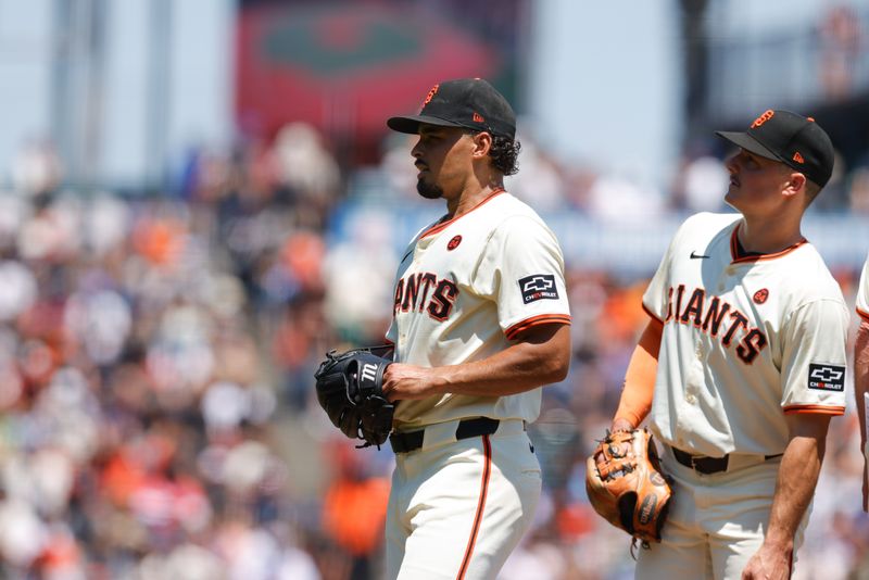 Jul 11, 2024; San Francisco, California, USA; San Francisco Giants pitcher Jordan Hicks (12) is removed from the game during the fifth inning against the Toronto Blue Jays at Oracle Park. Mandatory Credit: Sergio Estrada-USA TODAY Sports