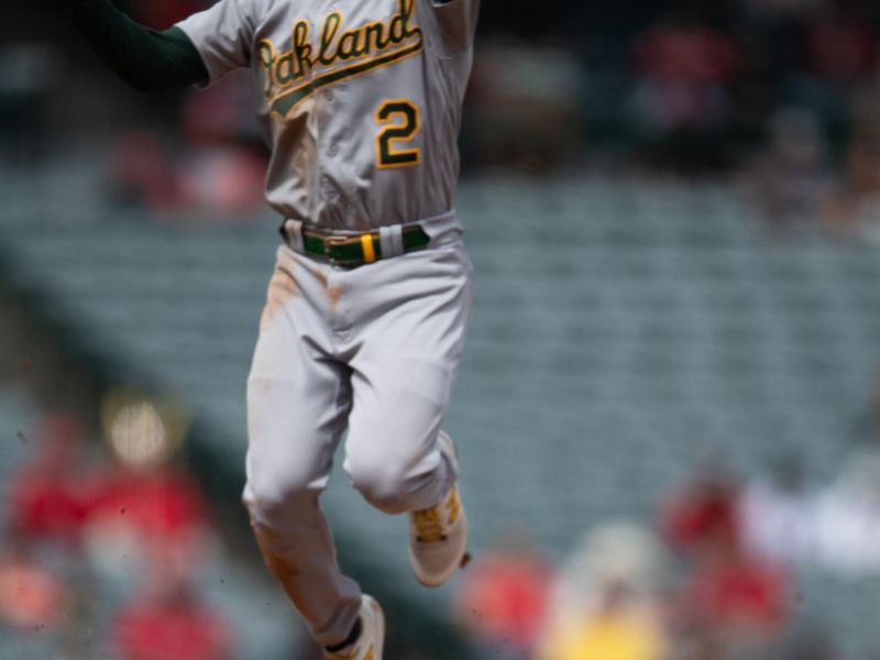 Oct 1, 2023; Anaheim, California, USA; Los Angeles Angels right fielder Jo Adell (7) steals second base against the Oakland Athletics shortstop Nick Allen (2) during the fourth inning at Angel Stadium. Mandatory Credit: Jonathan Hui-USA TODAY Sports