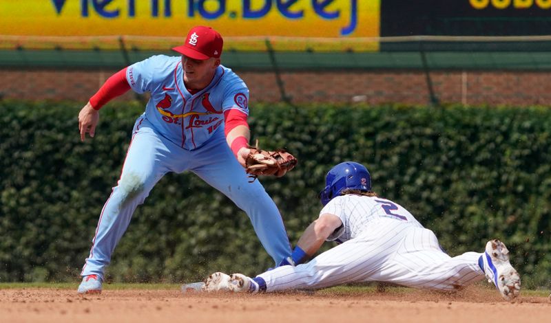 Aug 3, 2024; Chicago, Illinois, USA; Chicago Cubs second baseman Nico Hoerner (2) steals second base as St. Louis Cardinals second baseman Nolan Gorman (16) makes a late tag during the fourth inning at Wrigley Field. Mandatory Credit: David Banks-USA TODAY Sports