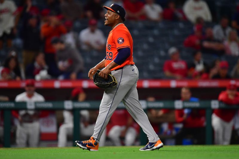 Jun 7, 2024; Anaheim, California, USA; Houston Astros pitcher Framber Valdez (59) celebrates the victory against the Los Angeles Angels at Angel Stadium. Mandatory Credit: Gary A. Vasquez-USA TODAY Sports