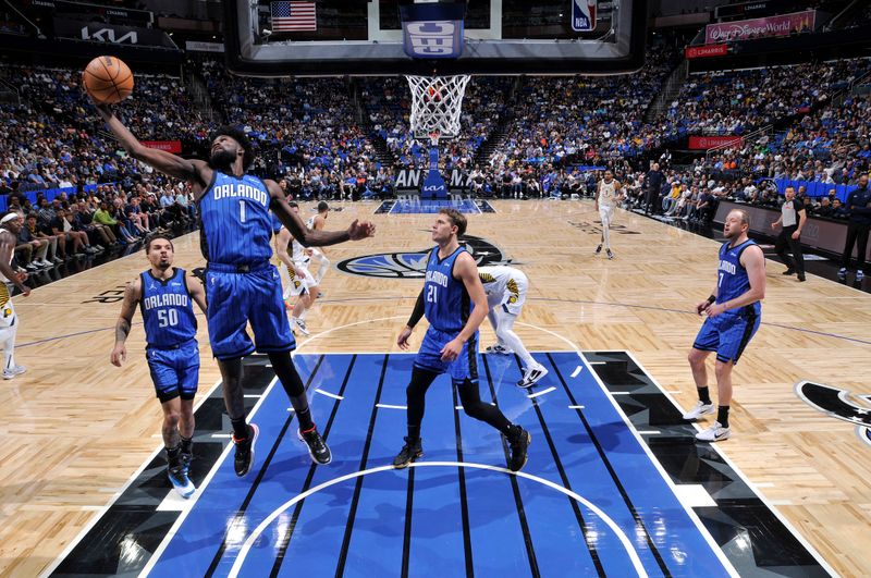 ORLANDO, FL - MARCH 10: Jonathan Isaac #1 of the Orlando Magic grabs the rebound during the game on March 10, 2024 at Amway Center in Orlando, Florida. NOTE TO USER: User expressly acknowledges and agrees that, by downloading and or using this photograph, User is consenting to the terms and conditions of the Getty Images License Agreement. Mandatory Copyright Notice: Copyright 2024 NBAE (Photo by Fernando Medina/NBAE via Getty Images)