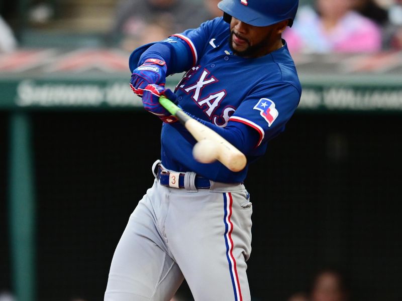 Sep 16, 2023; Cleveland, Ohio, USA; Texas Rangers center fielder Leody Taveras (23) hits a single during the third inning against the Cleveland Guardians at Progressive Field. Mandatory Credit: Ken Blaze-USA TODAY Sports