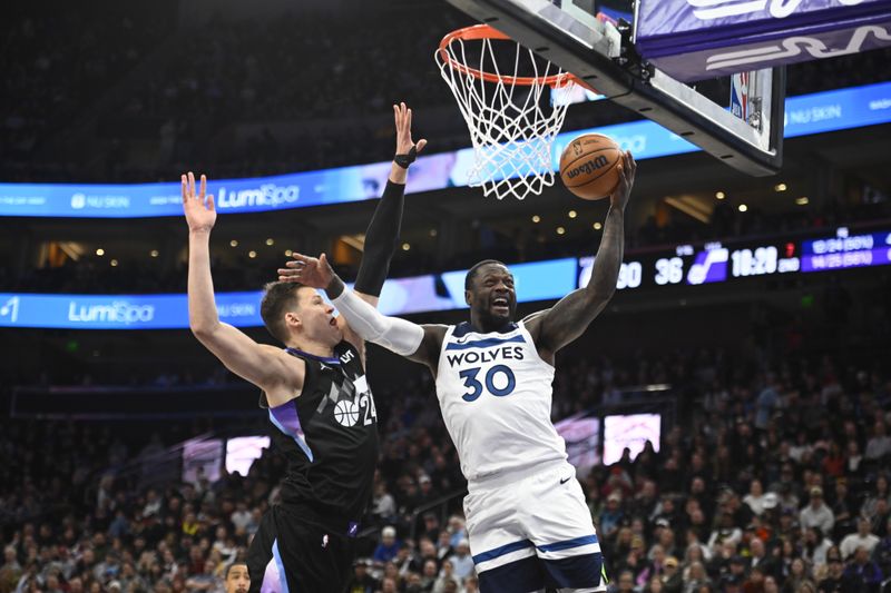 SALT LAKE CITY, UTAH - JANUARY 30: Julius Randle #30 of the Minnesota Timberwolves shoots over Walker Kessler #24 of the Utah Jazz during the first half of a game at Delta Center on January 30, 2025 in Salt Lake City, Utah. NOTE TO USER: User expressly acknowledges and agrees that, by downloading and or using this photograph, User is consenting to the terms and conditions of the Getty Images License Agreement.  (Photo by Alex Goodlett/Getty Images)