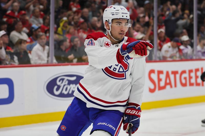 Feb 29, 2024; Sunrise, Florida, USA; Montreal Canadiens center Nick Suzuki (14) celebrates after scoring against the Florida Panthers during the first period at Amerant Bank Arena. Mandatory Credit: Sam Navarro-USA TODAY Sports