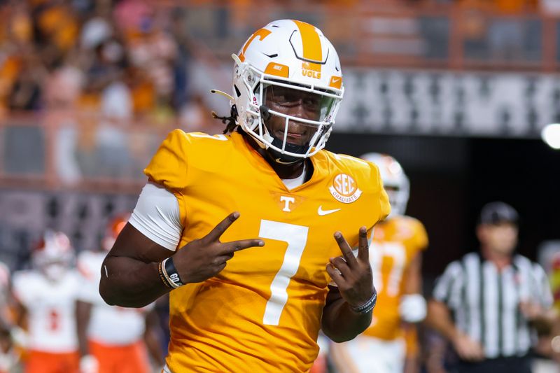 Sep 2, 2021; Knoxville, Tennessee, USA; Tennessee Volunteers quarterback Joe Milton III (7) reacts after scoring a touchdown against the Bowling Green Falcons during the first quarter at Neyland Stadium. Mandatory Credit: Randy Sartin-USA TODAY Sports