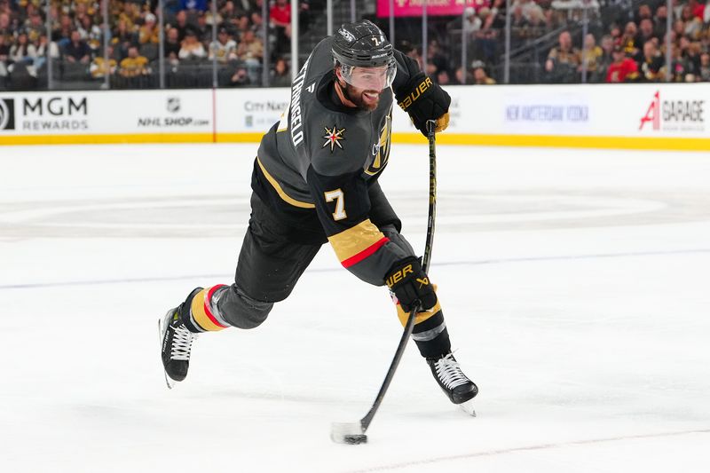 Mar 23, 2025; Las Vegas, Nevada, USA; Vegas Golden Knights defenseman Alex Pietrangelo (7) shoots against the Tampa Bay Lightning during the second period at T-Mobile Arena. Mandatory Credit: Stephen R. Sylvanie-Imagn Images