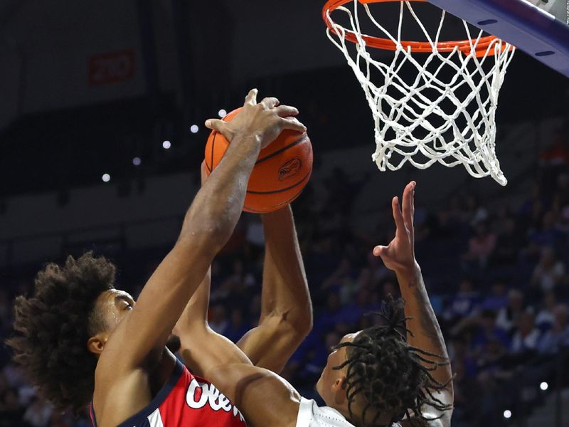 Feb 15, 2023; Gainesville, Florida, USA; Mississippi Rebels forward Jaemyn Brakefield (4) and Florida Gators guard Will Richard (5) go after the rebound during the second half at Exactech Arena at the Stephen C. O'Connell Center. Mandatory Credit: Kim Klement-USA TODAY Sports