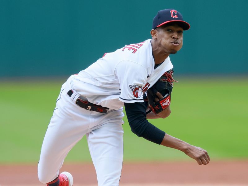 Sep 24, 2023; Cleveland, Ohio, USA; Cleveland Guardians starting pitcher Triston McKenzie (11) pitches against the Baltimore Orioles during the first inning at Progressive Field. Mandatory Credit: Aaron Josefczyk-USA TODAY Sports