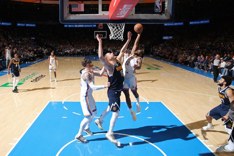 OKLAHOMA CITY, OK - MARCH 10: Cason Wallace #22 of the Oklahoma City Thunder rebounds during the game against the Denver Nuggets on March 10, 2025 at Paycom Center in Oklahoma City, Oklahoma. NOTE TO USER: User expressly acknowledges and agrees that, by downloading and or using this photograph, User is consenting to the terms and conditions of the Getty Images License Agreement. Mandatory Copyright Notice: Copyright 2025 NBAE(Photo by Zach Beeker/NBAE via Getty Images)