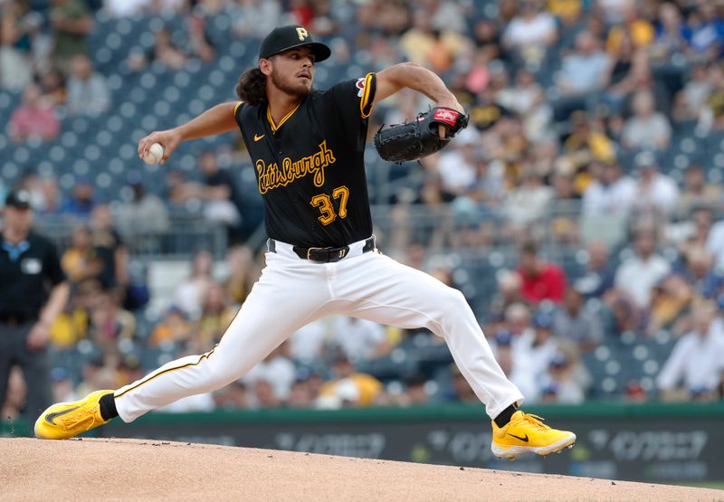 Jun 4, 2024; Pittsburgh, Pennsylvania, USA;  Pittsburgh Pirates starting pitcher Jared Jones (37) delivers a pitch against the Los Angeles Dodgers during the first inning at PNC Park. Mandatory Credit: Charles LeClaire-USA TODAY Sports