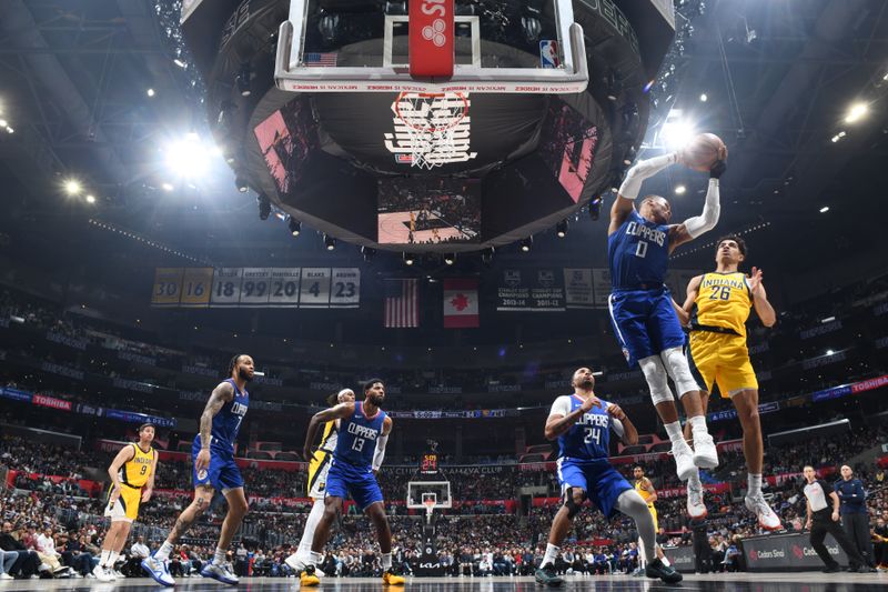 LOS ANGELES, CA - MARCH 25: Russell Westbrook #0 of the LA Clippers rebounds the ball during the game against the Indiana Pacers on March 25, 2024 at Crypto.Com Arena in Los Angeles, California. NOTE TO USER: User expressly acknowledges and agrees that, by downloading and/or using this Photograph, user is consenting to the terms and conditions of the Getty Images License Agreement. Mandatory Copyright Notice: Copyright 2024 NBAE (Photo by Adam Pantozzi/NBAE via Getty Images)