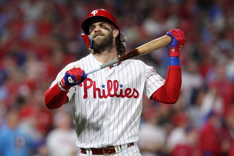 Oct 24, 2023; Philadelphia, Pennsylvania, USA; Philadelphia Phillies designated hitter Bryce Harper (3) reacts after making an out against the Arizona Diamondbacks in the fifth inning for game seven of the NLCS for the 2023 MLB playoffs at Citizens Bank Park. Mandatory Credit: Bill Streicher-USA TODAY Sports