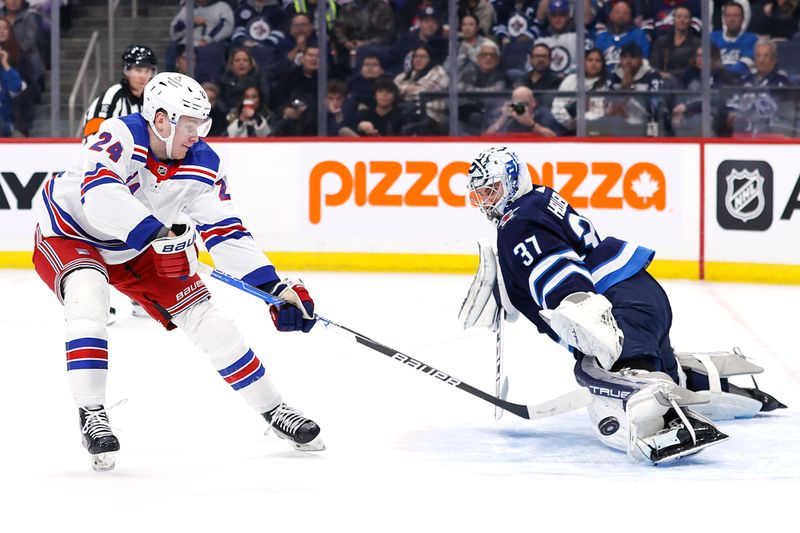 Oct 30, 2023; Winnipeg, Manitoba, CAN; \New York Rangers right wing Kaapo Kakko (24) has a shot blocked by Winnipeg Jets goaltender Connor Hellebuyck (37) in the first period at Canada Life Centre. Mandatory Credit: James Carey Lauder-USA TODAY Sports