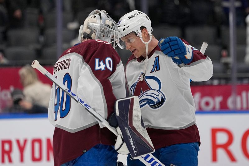 Jan 13, 2024; Toronto, Ontario, CAN; Colorado Avalanche forward Nathan MacKinnon (29) and goaltender Alexandar Georgiev (40) celebrate a win over the Toronto Maple Leafs during the third period at Scotiabank Arena. Mandatory Credit: John E. Sokolowski-USA TODAY Sports