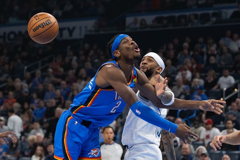 OKLAHOMA CITY, OKLAHOMA - JANUARY 29: Shai Gilgeous-Alexander #2 of the Oklahoma City Thunder gets tangled up with Nickeil Alexander-Walker #9 of the Minnesota Timberwolves during the first half at Paycom Center on January 29, 2024 in Oklahoma City, Oklahoma. NOTE TO USER: User expressly acknowledges and agrees that, by downloading and or using this Photograph, user is consenting to the terms and conditions of the Getty Images License Agreement. (Photo by Joshua Gateley/Getty Images)