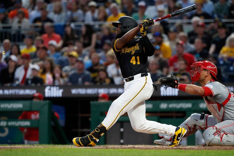 Aug 22, 2024; Pittsburgh, Pennsylvania, USA;  Pittsburgh Pirates right fielder Bryan De La Cruz (41) hits a three run double against the Cincinnati Reds during the fifth inning at PNC Park. Mandatory Credit: Charles LeClaire-USA TODAY Sports