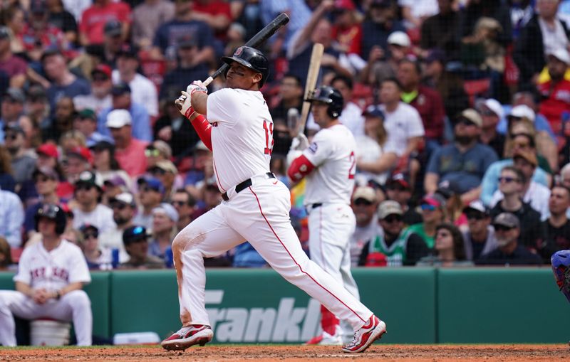 May 8, 2025; Boston, Massachusetts, USA; Boston Red Sox designated hitter Rafael Devers (11) hits a home run against the Texas Rangers in the seventh inning at Fenway Park. Mandatory Credit: David Butler II-Imagn Images