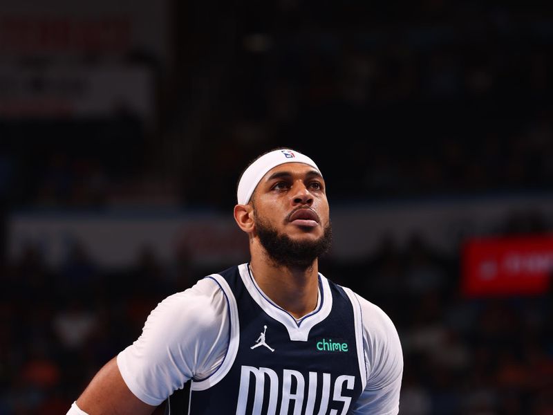 OKLAHOMA CITY, OK - MARCH 14: Daniel Gafford #21 of the Dallas Mavericks shoots a free throw during the game against the Oklahoma City Thunder on March 13, 2024 at Paycom Arena in Oklahoma City, Oklahoma. NOTE TO USER: User expressly acknowledges and agrees that, by downloading and or using this photograph, User is consenting to the terms and conditions of the Getty Images License Agreement. Mandatory Copyright Notice: Copyright 2024 NBAE (Photo by Zach Beeker/NBAE via Getty Images)