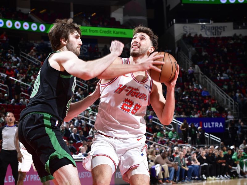 HOUSTON, TX - JANUARY 21: Alperen Sengun #28 of the Houston Rockets handles the ball during the game against the Boston Celtics on January 21, 2024 at the Toyota Center in Houston, Texas. NOTE TO USER: User expressly acknowledges and agrees that, by downloading and or using this photograph, User is consenting to the terms and conditions of the Getty Images License Agreement. Mandatory Copyright Notice: Copyright 2024 NBAE (Photo by Logan Riely/NBAE via Getty Images)