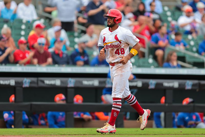 Feb 24, 2025; Jupiter, Florida, USA;  St. Louis Cardinals catcher Ivan Herrera (48) scores against the New York Mets during the second inning at Roger Dean Chevrolet Stadium. Mandatory Credit: Sam Navarro-Imagn Images