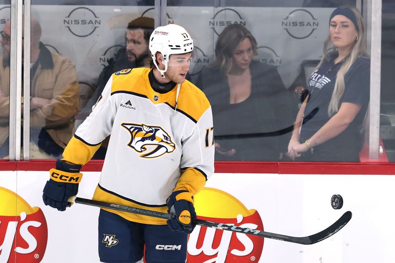 Jan 7, 2025; Winnipeg, Manitoba, CAN; Nashville Predators center Mark Jankowski (17) puck juggles before a game against the Winnipeg Jets at Canada Life Centre. Mandatory Credit: James Carey Lauder-Imagn Images