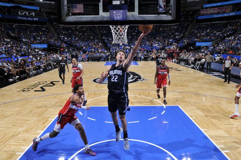 ORLANDO, FL - NOVMEBER 10:  Franz Wagner #22 of the Orlando Magic drives to the basket during the game against the Washington Wizards on November 10, 2024 at Kia Center in Orlando, Florida. NOTE TO USER: User expressly acknowledges and agrees that, by downloading and or using this photograph, User is consenting to the terms and conditions of the Getty Images License Agreement. Mandatory Copyright Notice: Copyright 2024 NBAE (Photo by Fernando Medina/NBAE via Getty Images)