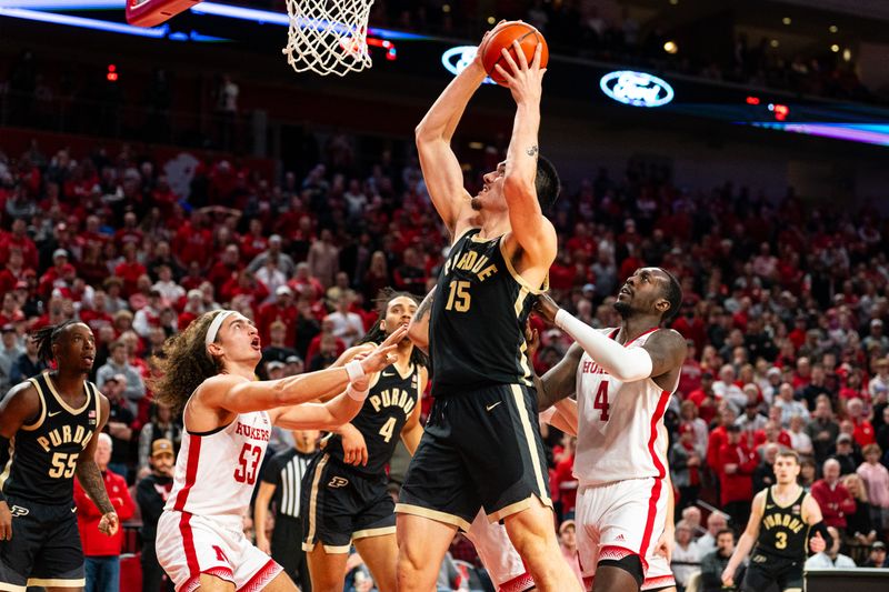 Jan 9, 2024; Lincoln, Nebraska, USA; Purdue Boilermakers center Zach Edey (15) shoots the ball again Nebraska Cornhuskers forward Josiah Allick (53) and forward Juwan Gary (4) during the second half at Pinnacle Bank Arena. Mandatory Credit: Dylan Widger-USA TODAY Sports