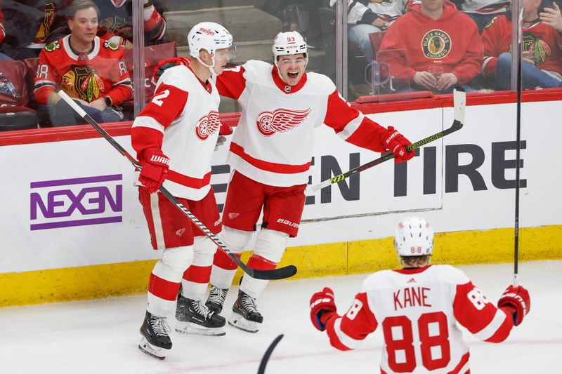 Feb 25, 2024; Chicago, Illinois, USA; Detroit Red Wings right wing Alex DeBrincat (93) celebrates with teammates after scoring against the Chicago Blackhawks during the third period at United Center. Mandatory Credit: Kamil Krzaczynski-USA TODAY Sports