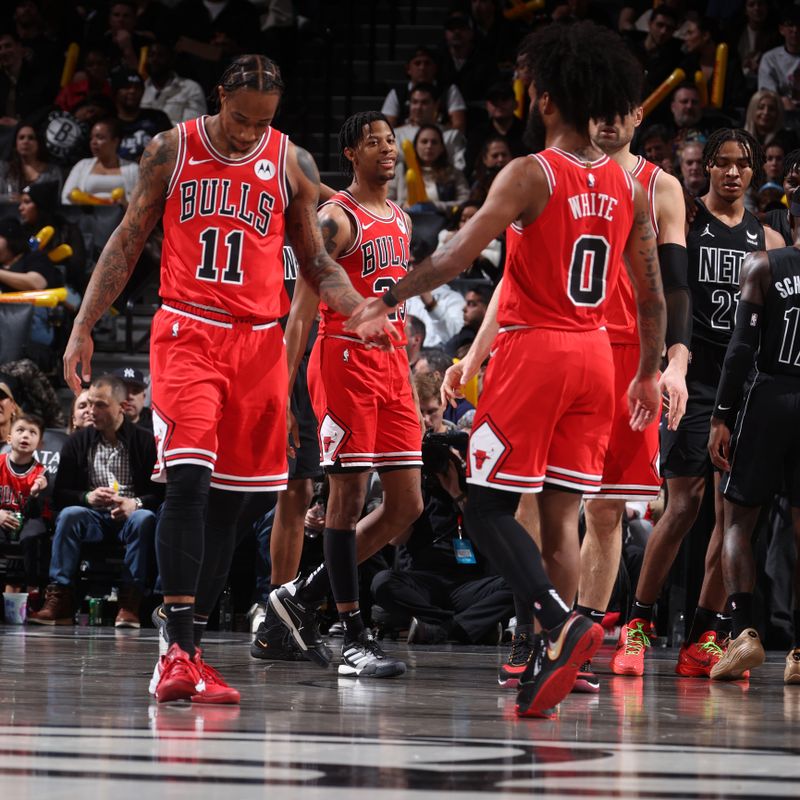 BROOKLYN, NY - MARCH 29: DeMar DeRozan #11 and Coby White #0 of the Chicago Bulls high five during the game against the Brooklyn Nets on March 29, 2024 at Barclays Center in Brooklyn, New York. NOTE TO USER: User expressly acknowledges and agrees that, by downloading and or using this Photograph, user is consenting to the terms and conditions of the Getty Images License Agreement. Mandatory Copyright Notice: Copyright 2024 NBAE (Photo by Nathaniel S. Butler/NBAE via Getty Images)