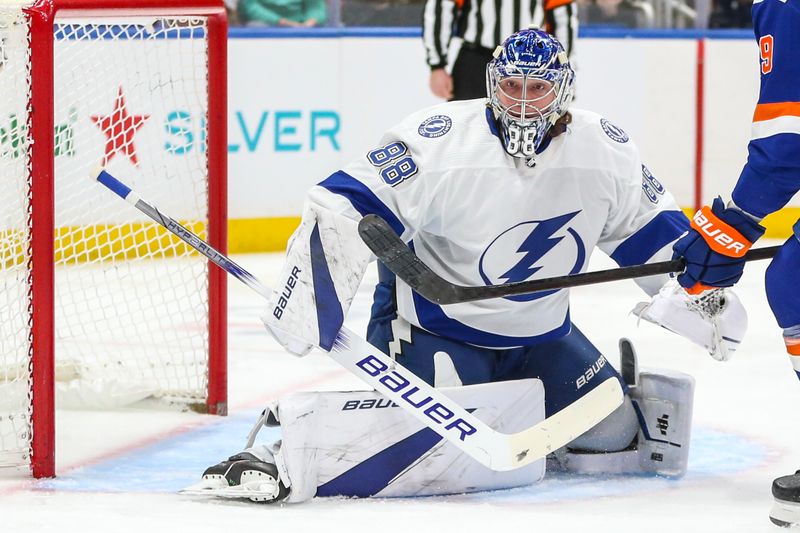 Feb 24, 2024; Elmont, New York, USA;  Tampa Bay Lightning goaltender Andrei Vasilevskiy (88) defends the net in the second period against the New York Islanders at UBS Arena. Mandatory Credit: Wendell Cruz-USA TODAY Sports