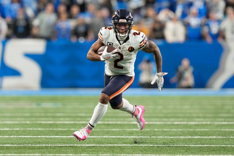 Chicago Bears wide receiver DJ Moore (2) runs after a catch against the Detroit Lions during the second half of an NFL football game in Detroit, Thursday, Nov. 28, 2024. (AP Photo/Carlos Osorio)