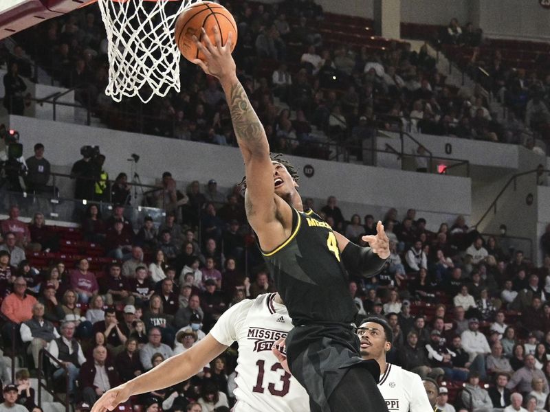 Feb 4, 2023; Starkville, Mississippi, USA; Missouri Tigers guard DeAndre Gholston (4) goes up for a shot against the Mississippi State Bulldogs during the first half at Humphrey Coliseum. Mandatory Credit: Matt Bush-USA TODAY Sports