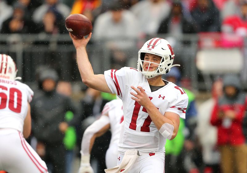 Oct 26, 2019; Columbus, OH, USA; Wisconsin Badgers quarterback Jack Coan (17) drops back to throw during the first quarter against the Ohio State Buckeyes at Ohio Stadium. Mandatory Credit: Joe Maiorana-USA TODAY Sports