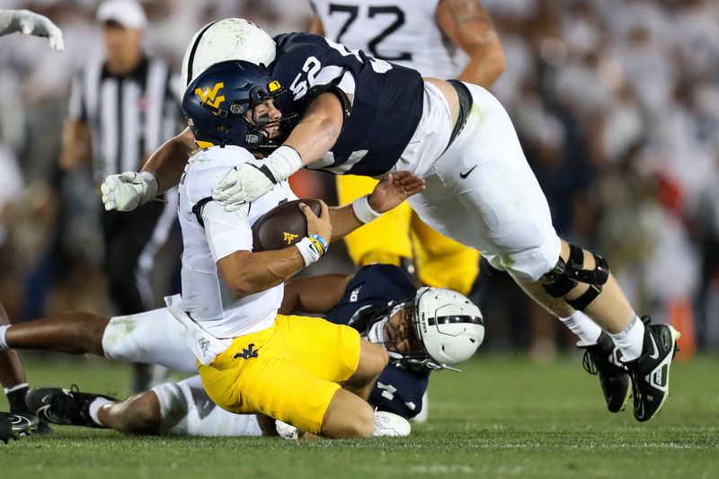 Sep 2, 2023; University Park, Pennsylvania, USA; West Virginia Mountaineers quarterback Garrett Greene (6) is tackled by Penn State Nittany Lions defensive tackle Jordan van den Berg (52) during the third quarter at Beaver Stadium. Penn State defeated West Virginia 38-15. Mandatory Credit: Matthew O'Haren-USA TODAY Sports