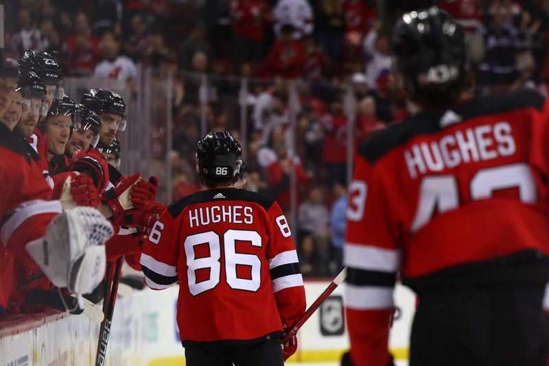 Mar 21, 2024; Newark, New Jersey, USA; New Jersey Devils center Jack Hughes (86) celebrates his goal against the Winnipeg Jets during the second period at Prudential Center. Mandatory Credit: Ed Mulholland-USA TODAY Sports