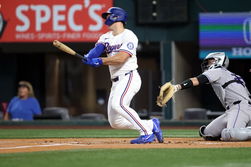 May 14, 2025; Arlington, Texas, USA; Texas Rangers outfielder Wyatt Langford (36) hits a two run home run against the Colorado Rockies during the first inning at Globe Life Field. Mandatory Credit: Tim Heitman-Imagn Images
