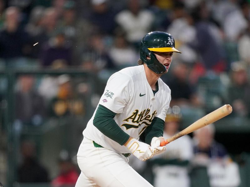 Apr 23, 2025; West Sacramento, California, USA; Athletics first baseman Nick Kurtz (16) hits a ground ball against the Texas Rangers in the second inning at Sutter Health Park. Mandatory Credit: Cary Edmondson-Imagn Images