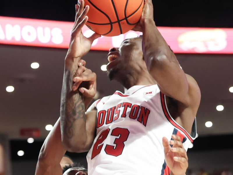 Feb 10, 2025; Houston, Texas, USA;  Houston Cougars guard Terrance Arceneaux (23) is defended by Baylor Bears guard Jayden Nunn (2) in the first half at Fertitta Center. Mandatory Credit: Thomas Shea-Imagn Images
