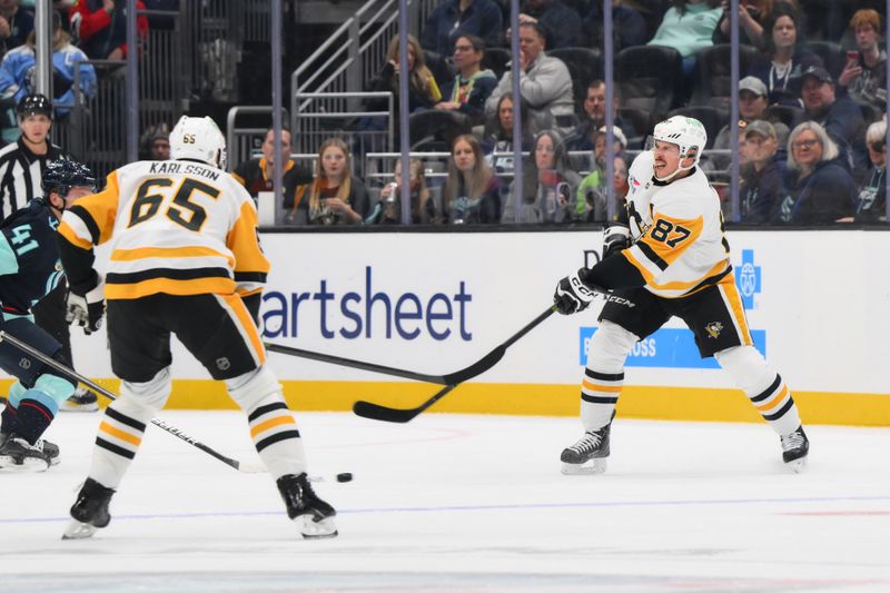 Jan 25, 2025; Seattle, Washington, USA; Pittsburgh Penguins center Sidney Crosby (87) shoots the puck against the Seattle Kraken during the first period at Climate Pledge Arena. Mandatory Credit: Steven Bisig-Imagn Images