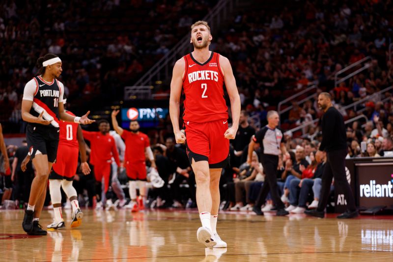 HOUSTON, TEXAS - MARCH 25: Jock Landale #2 of the Houston Rockets reacts after making a three-point basket in the first half against the Portland Trail Blazers at Toyota Center on March 25, 2024 in Houston, Texas.  NOTE TO USER: User expressly acknowledges and agrees that, by downloading and or using this photograph, User is consenting to the terms and conditions of the Getty Images License Agreement. (Photo by Tim Warner/Getty Images)