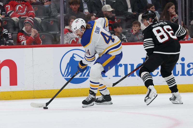 Dec 21, 2025; Newark, New Jersey, USA;  Buffalo Sabres center Josh Dunne (44) looks to make a pass against the New Jersey Devils during the first period at Prudential Center. Mandatory Credit: Thomas Salus-Imagn Images