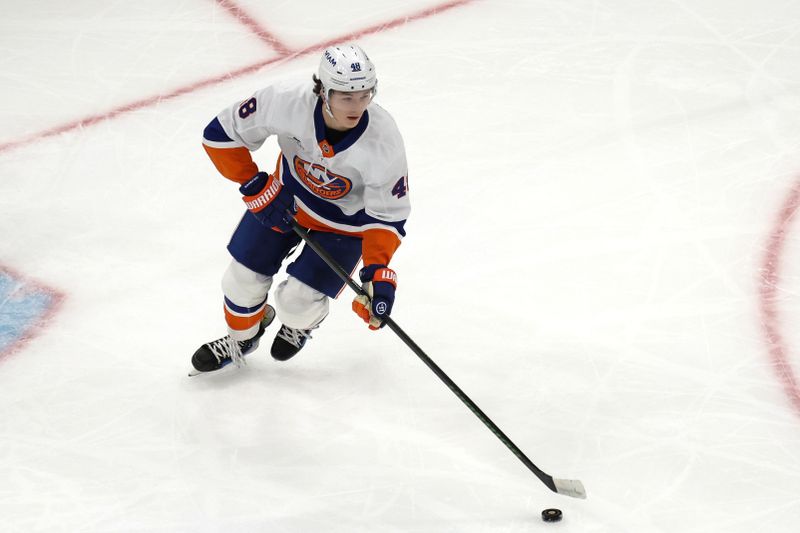 Oct 28, 2025; Boston, Massachusetts, USA; New York Islanders defenseman Matthew Schaefer (48) skates the puck against the Boston Bruins during the first period at TD Garden. Mandatory Credit: Winslow Townson-Imagn Images