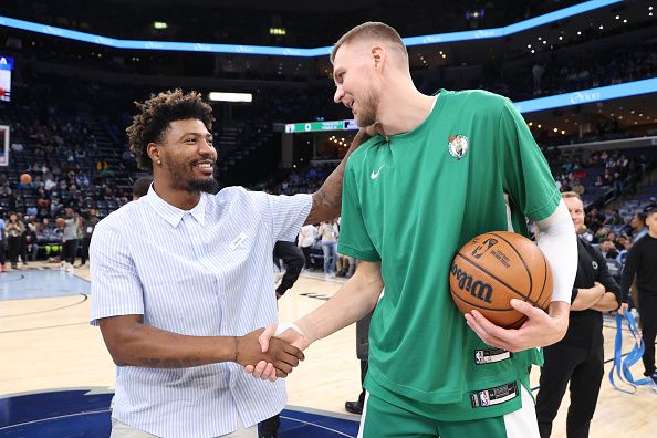 MEMPHIS, TN - NOVEMBER 19: Marcus Smart #36 of the Memphis Grizzlies talks to Kristaps Porzingis #8 of the Boston Celtics before the game on November 19, 2023 at FedExForum in Memphis, Tennessee. NOTE TO USER: User expressly acknowledges and agrees that, by downloading and or using this photograph, User is consenting to the terms and conditions of the Getty Images License Agreement. Mandatory Copyright Notice: Copyright 2023 NBAE (Photo by Joe Murphy/NBAE via Getty Images)