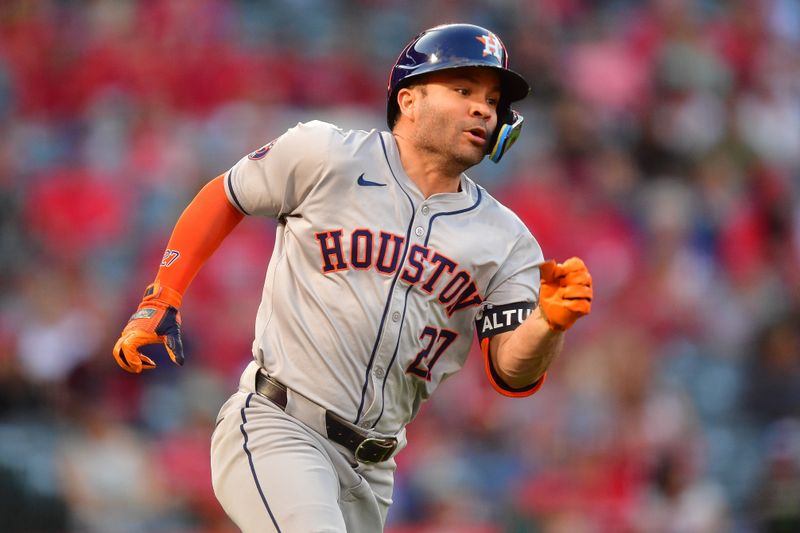 Sep 13, 2024; Anaheim, California, USA; Houston Astros second baseman Jose Altuve (27) runs after hitting a single against the Los Angeles Angels during the first inning at Angel Stadium. Mandatory Credit: Gary A. Vasquez-Imagn Images