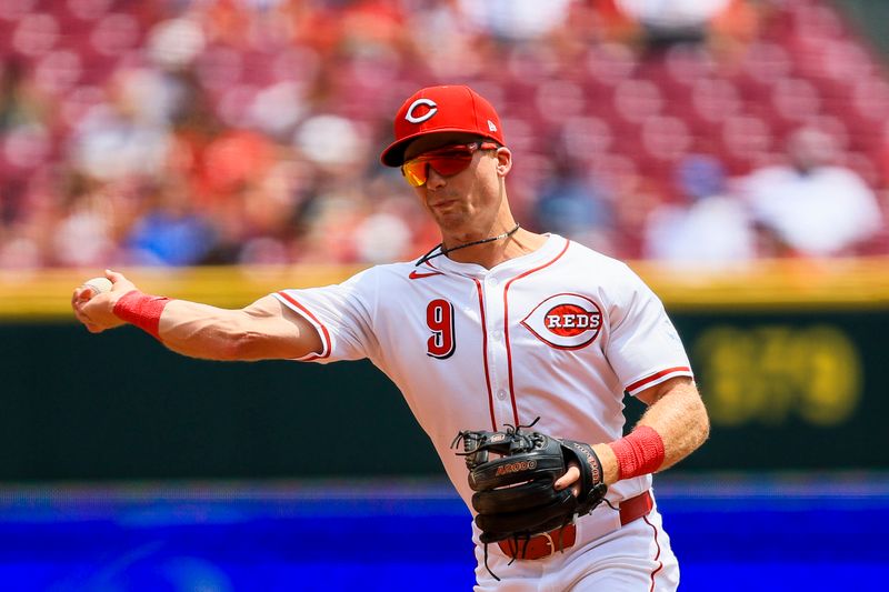 Jun 4, 2025; Cincinnati, Ohio, USA; Cincinnati Reds second baseman Matt McLain (9) throws to first to get Milwaukee Brewers shortstop Joey Ortiz (not pictured) out in the fourth inning at Great American Ball Park. Mandatory Credit: Katie Stratman-Imagn Images