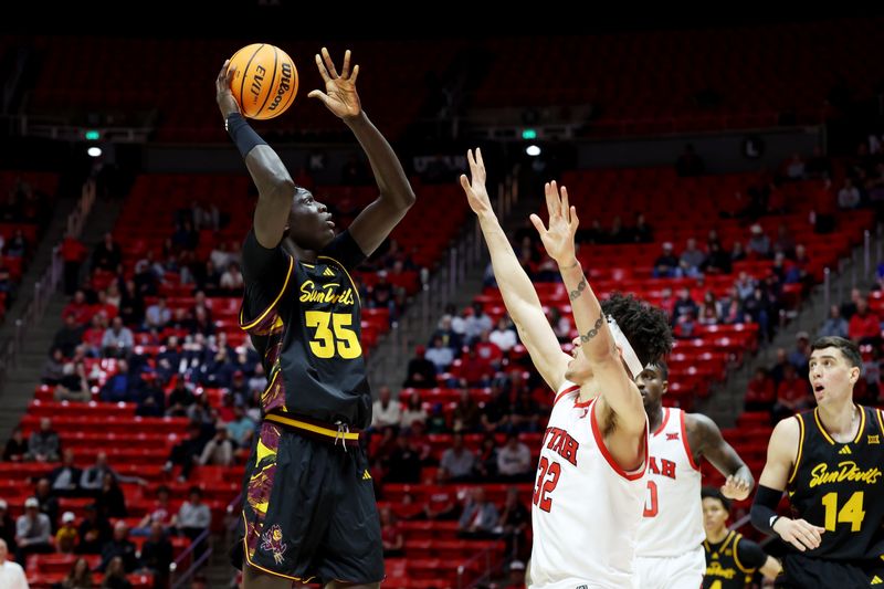 Feb 4, 2026; Salt Lake City, Utah, USA; Arizona State Sun Devils center Massamba Diop (35) goes up for a shot against Utah Utes forward James Okonkwo (32) during the first half at Jon M. Huntsman Center. Mandatory Credit: Rob Gray-Imagn Images
