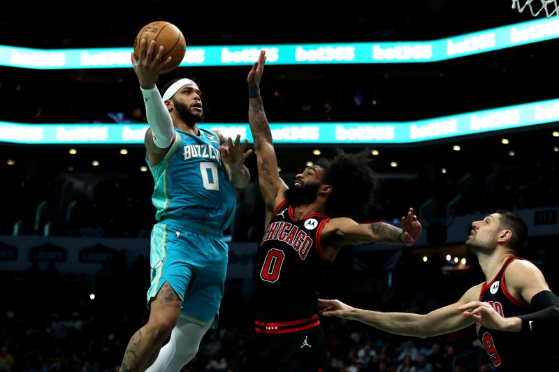 CHARLOTTE, NORTH CAROLINA - JANUARY 31: Coby White #0 of the Chicago Bulls defends Miles Bridges #0 of the Charlotte Hornets during the second half of an NBA game at Spectrum Center on January 31, 2024 in Charlotte, North Carolina. NOTE TO USER: User expressly acknowledges and agrees that, by downloading and or using this photograph, User is consenting to the terms and conditions of the Getty Images License Agreement. (Photo by David Jensen/Getty Images)